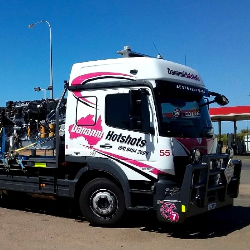 Dananni Hotshots tray truck loaded with industrial plant